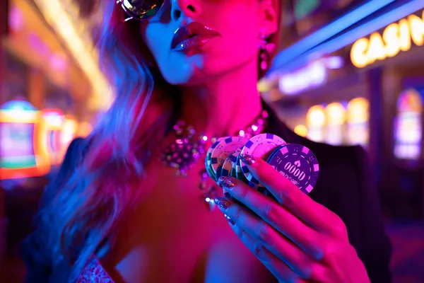 A confident dealer surrounded by casino chips inviting players to access their BK33B account, reflecting quick and easy login options.