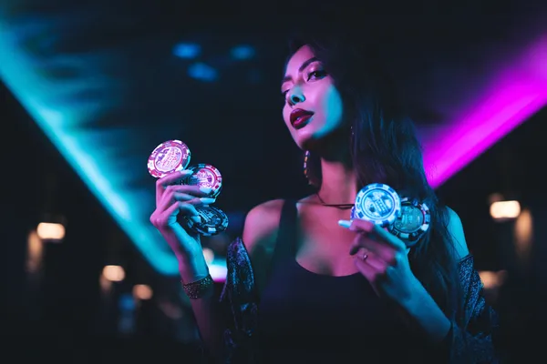 A person using their device against a moody casino-themed background, illustrating the smooth re-entry process at BK33B.